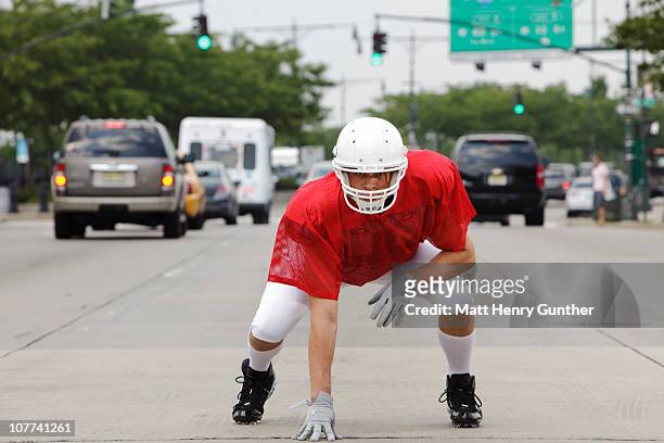 football player in the streets of new york - quarterback stock-fotos und bilder