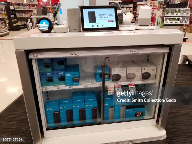 Close-up of display of multiple Amazon Echo and Amazon Alexa smart speaker devices from Amazon and Google Inc, part of smart home offerings at a...