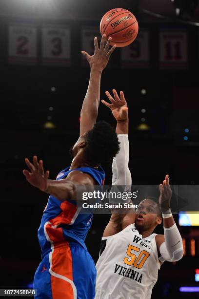 Sagaba Konate of the West Virginia Mountaineers attempts a basket during the first half of the game against the Florida Gators at Madison Square...