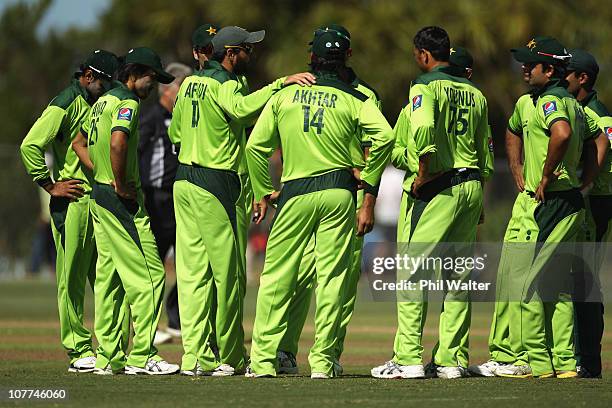 Pakistan re-group before leaving the field following the Twenty20 trial match between Pakistan and the Auckland Aces at Colin Maiden Park on December...