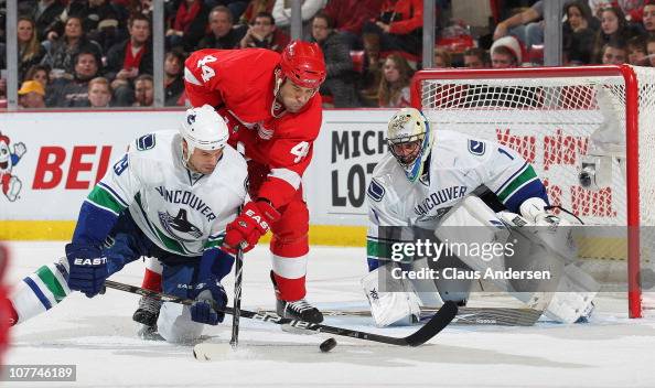 Aaron Rome Roberto Luongo and Aaron Rome of the Vancouver Canucks stop a scoring ...