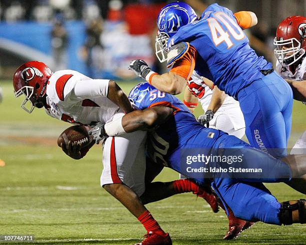Boise State defensive tackle J.P. Nisby stops Utah quarterback Terrance Cain during the Broncos' 26-3 victory over Utah in the MAACO Las Vegas Bowl...