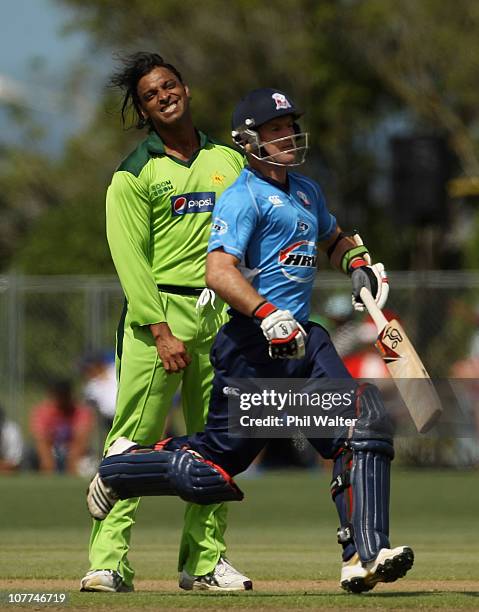 Shoaib Akhtar of Pakistan shows his frustration as Gareth Hopkins of the Aces runs during the Twenty20 trial match between Pakistan and the Auckland...