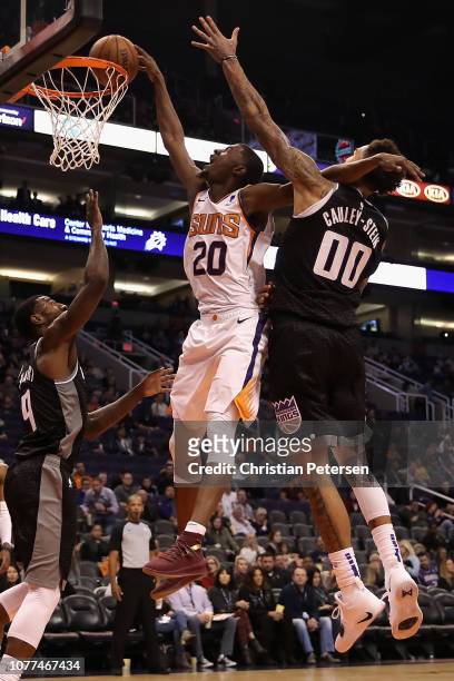 Josh Jackson of the Phoenix Suns attempts a slam-dunk against Willie Cauley-Stein of the Sacramento Kings during the second half of the NBA game at...