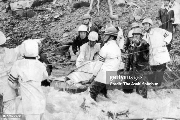 Body of a victim is recovered after torrential rain on July 24, 1982 in Nagasaki, Japan. 299 people were killed.