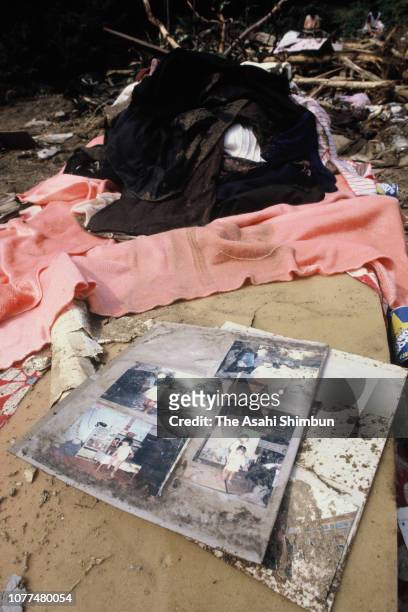 Photographs are seen at a place their house used to stand after a landslide is seen triggered by Typhoon Bess hits across Japan on August 4, 1982 in...