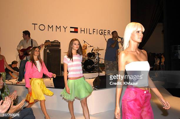 Dewi Driegen,Susan Eldridge, and Anouck Lepere wearing Tommy Hilfiger Spring 2004 with Pharrell Williams of N.E.R.D.