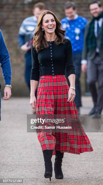Catherine, Duchess of Cambridge attends a party for families of military personnel deployed in Cyprus at Kensington Palace on December 04, 2018 in...