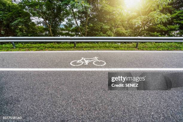 bike lane - crash barrier stock pictures, royalty-free photos & images