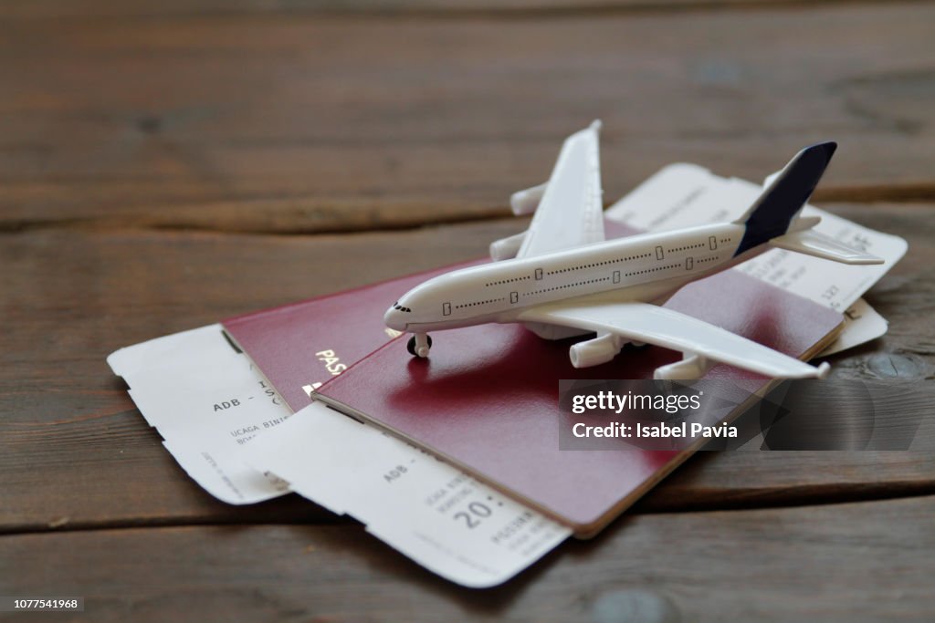 Toy Airplane With Passports and Flight booking ticket. Travel concept.