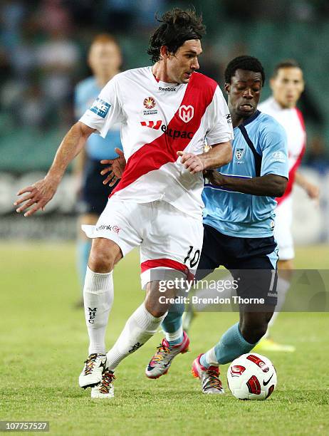 Wayne Srhoj of the Heart competes with Kofi Danning of Sydney during the round 20 A-League match between Sydney FC and the Melbourne Heart at Sydney...