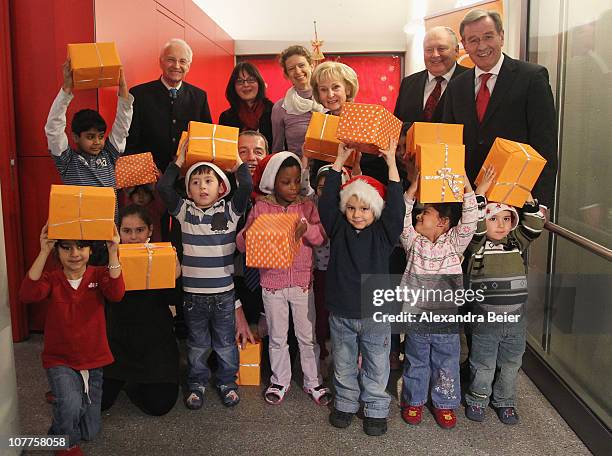 Former Bavarian Governor and curator of the DFL Foundation Edmund Stoiber, Johanna Hofmeir and Doerthe Friess of the social therapeutic project...