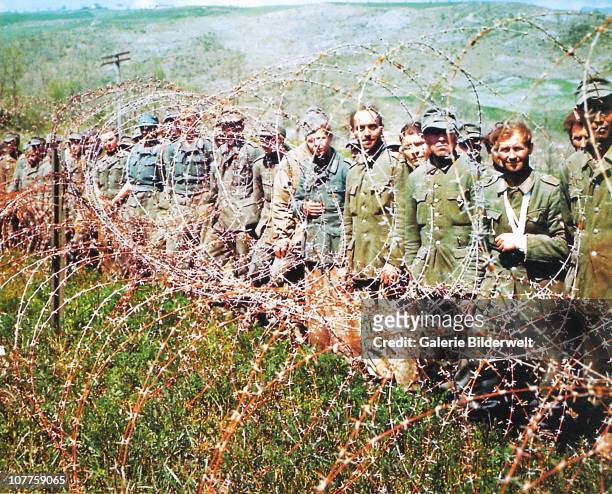 Operation Overlord Normandy, German Prisoners of War have been put behind barbed wire in Normandy. June 1944. More than 200,000 German soldiers were...