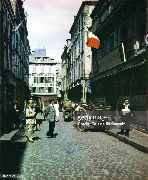 Operation Overlord Normandy, A street in Cherbourg, which has recently been liberated by the United States Army. July 1944. On the right side is the...