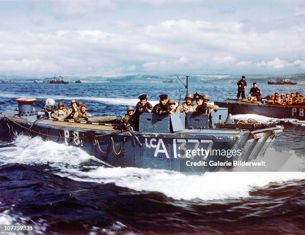 Operation Overlord Normandy, British Navy Landing Crafts carry United States Army Rangers to a ship in Southern England. 1st June 1944. There are...