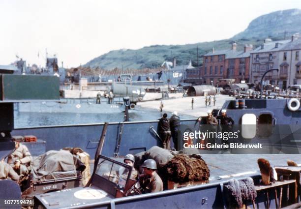 Operation Overlord Normandy, Two United States Army jeeps have been loaded onto a the Landing Craft Transport in a port in Southern England. June...