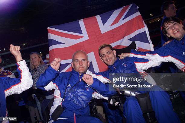 Athletes from Great Britain celebrate during the Closing Ceremony of the Sydney 2000 Paralympic Games at Olympic Stadium, Homebush Bay, Sydney,...