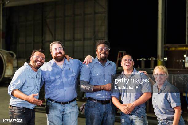 multi-ethnic workers in warehouse having meeting - large conference event stock pictures, royalty-free photos & images