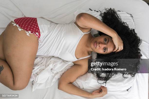 woman confident in the bed - cali colombia stock pictures, royalty-free photos & images