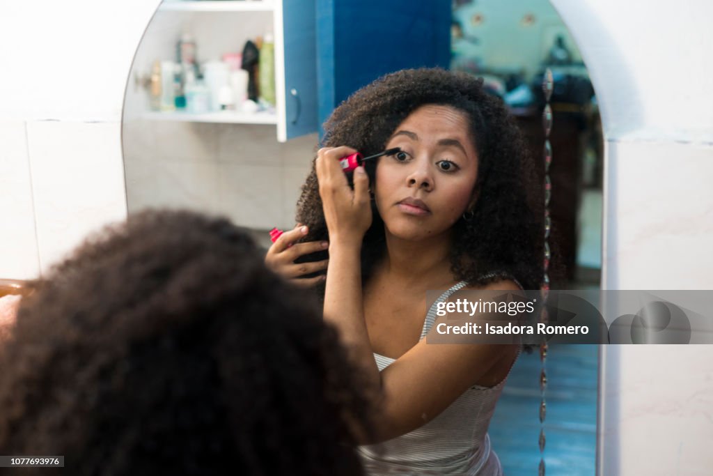 Woman getting ready in the bathroom