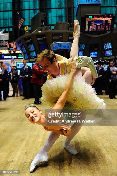 Dancers Ashley Bouder and Andrew Veyette from the New York City Ballet's "The Nutcracker" visit The New York Stock Exchange on December 23, 2010 in...