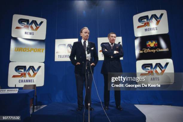 Media magnate Rupert Murdoch and broadcaster Andrew Neil at the launch of Sky TV in London, 5th February 1989.