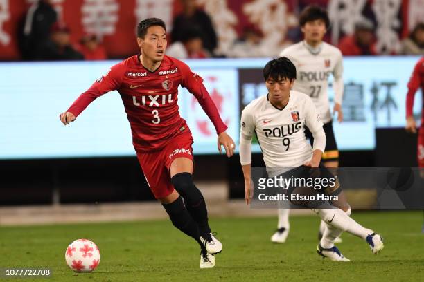 Gen Shoji of Kashima Antlers and Yuki Muto of Urawa Red Diamonds compete for the ball during the 98th Emperor's Cup semi final between Urawa Red...