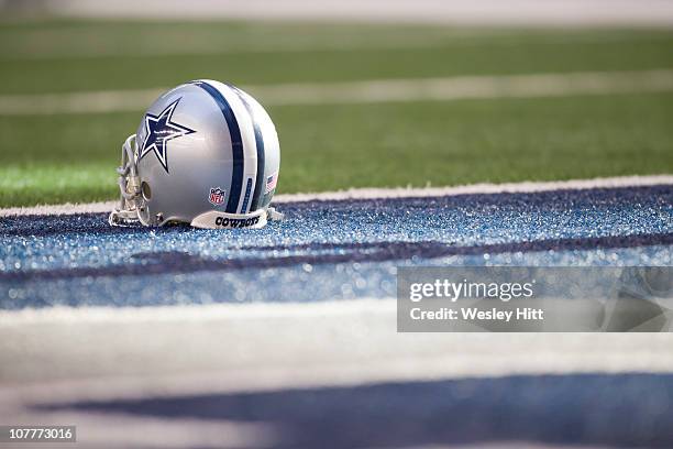 Helmet of the Dallas Cowboys sits on the field before a game against the Washington Redskins at Cowboys Stadium on December 19, 2010 in Arlington,...