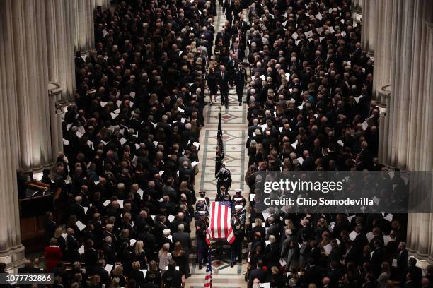 Members former President George H.W. Bush's family, including former President George W. Bush and former Florida Governor Jeb Bush, follow his casket...