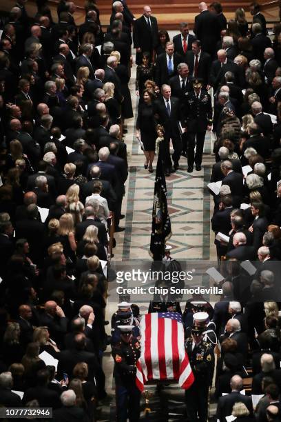Members former President George H.W. Bush's family, including former President George W. Bush and former Florida Governor Jeb Bush, follow his casket...