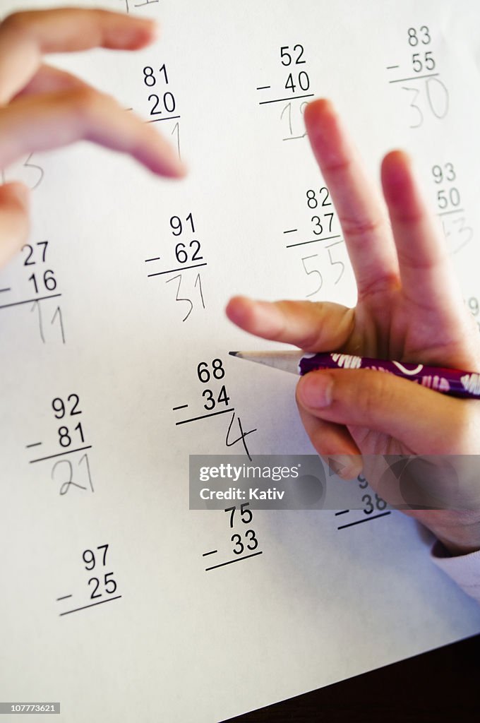 5 Year Old Solving Math Problems With Fingers High-Res Stock Photo ...