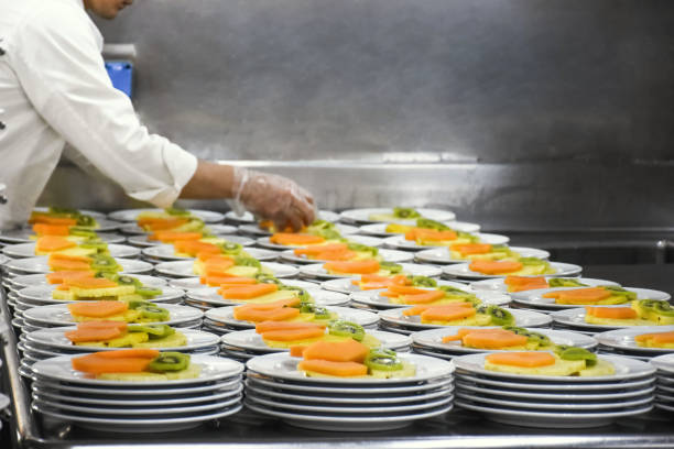 How to Start a Catering Service Company in South Africa 1 chef preparing 200 fruit salad portions as part of a fine dining restaurant menu