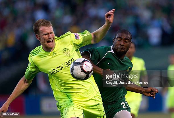 Taylor Graham of Seattle Sounders battles Bright Dike of the Portland Timbers during the Lamar Hunt U.S Open Cup on June 30, 2010 at PGE Park in...