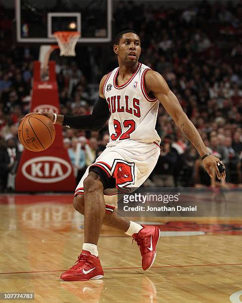 Watson of the Chicago Bulls looks to pass against the Philadelphia 76ers at the United Center on December 21, 2010 in Chicago, Illinois. The Bulls...