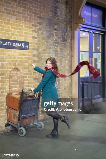 harry potter's platform 9 3/4 at kings cross london - railway station platform stock pictures, royalty-free photos & images