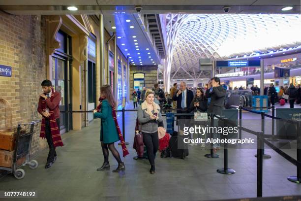 harry potter's platform 9 3/4 at kings cross london - harry potter scarf stock pictures, royalty-free photos & images