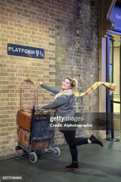 harry potter's platform 9 3/4 at kings cross london - harry potter scarf stock pictures, royalty-free photos & images