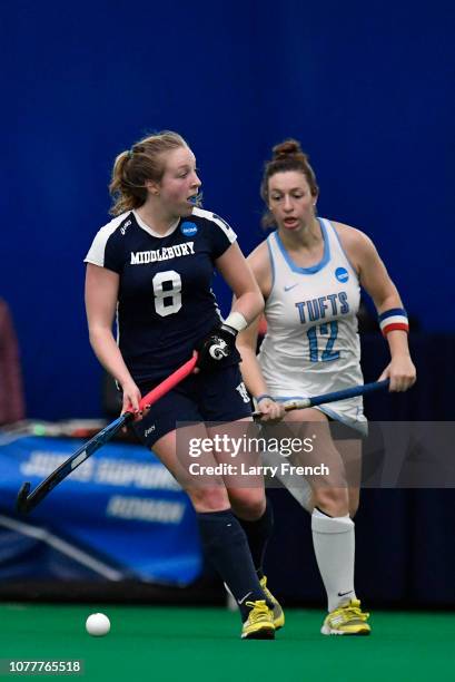 Isabel Chandler of the Middlebury Panthers guards the ball from Rachel Hamilton of the Tufts Jumbos during the Division III Women's Field Hockey...