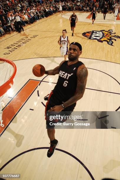 LeBron James of the Miami Heat dunks against the Phoenix Suns in an NBA game played on December 23, 2010 at U.S. Airways Center in Phoenix, Arizona....