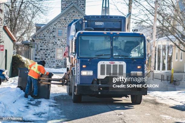 day of garbage collection in winter in quebec, saint-hugues - recycling truck canada stock pictures, royalty-free photos & images