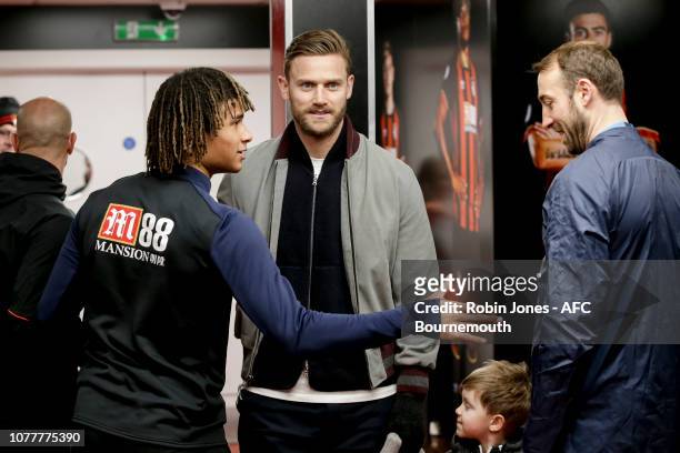Nathan Ake and an injured Simon Francis of Bournemouth in the tunnel with former team-mate Glenn Murray of Brighton & Hove Albion before the FA Cup...
