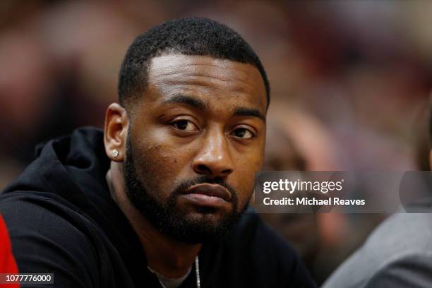 John Wall of the Washington Wizards looks on from the bench against the Miami Heat at American Airlines Arena on January 4, 2019 in Miami, Florida....