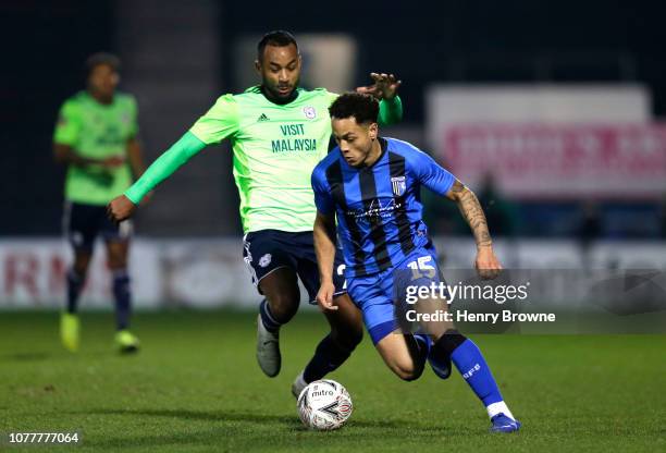 Loic Damour of Cardiff City battles for possession with Elliott List of Gillingham during the FA Cup Third Round match between Gillingham and Cardiff...