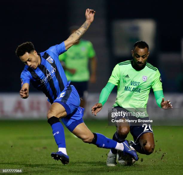 Loic Damour of Cardiff City battles for possession with Elliott List of Gillingham during the FA Cup Third Round match between Gillingham and Cardiff...
