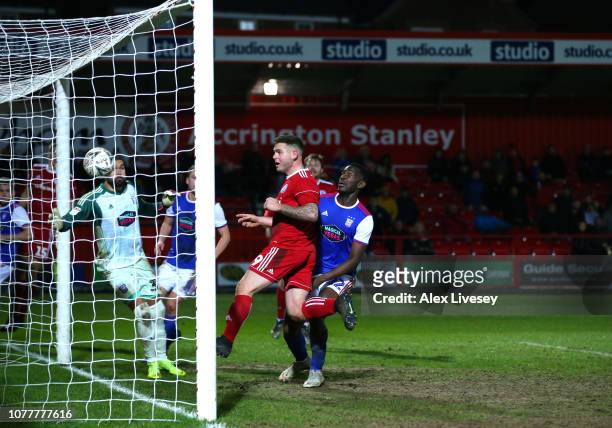 Billy Kee of Accrington Stanley scores his team's first goal past Bartosz Bialkowski of Ipswich Town during the FA Cup Third Round match between...
