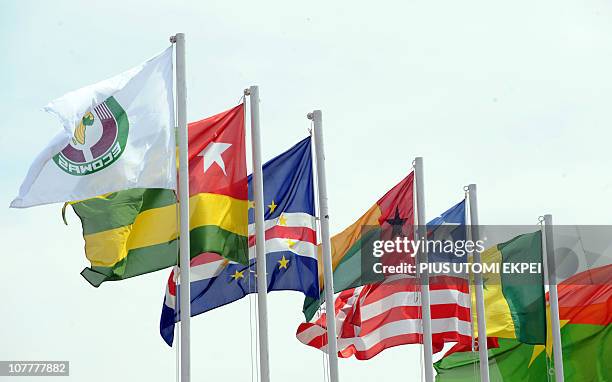 Flags are pictured during an emergency summit of the 15-member Economic Community of West African States on the political crisis in Ivory Coast in...