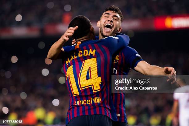 Malcom of FC Barcelona celebrates with his teammate Munir El Haddadi after scoring his team's third goal during the Copa del Rey fourth round second...