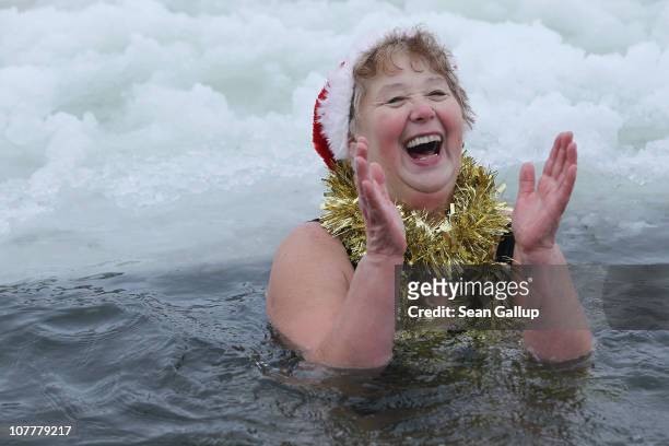 M not cold" exclaims Marina Hunger, a member of the Berlin Seals swimming club, as she takes a dip in icy Orankesee lake during the club's...