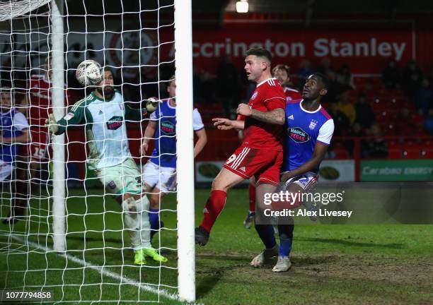 Billy Kee of Accrington Stanley scores his team's first goal past Bartosz Bialkowski of Ipswich Town during the FA Cup Third Round match between...