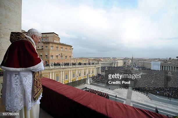 Pope Benedict XVI delivers his annual 'Urbi Et Orbis' blessing from the central balcony of St. Peter's Basilica on December 25, 2010 in Vatican City,...